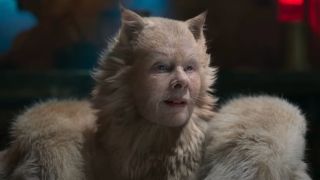 Dame Judi Dench smiling in cat form in Cats.
