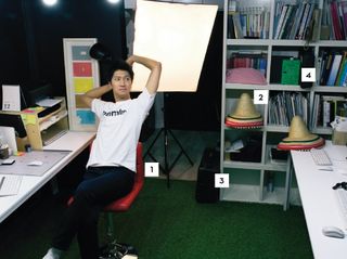 Wochan Lee relaxes in Minimalist's workspace