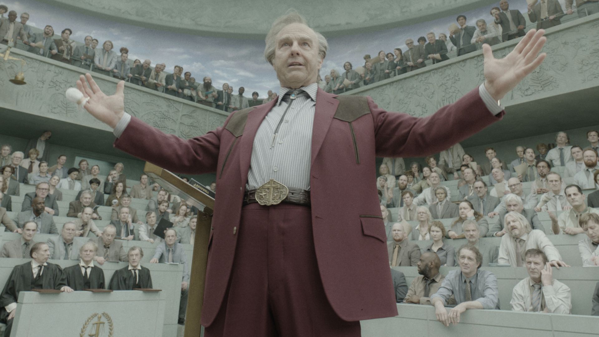 Digger Rockwell (Tom Cruise) addresses the public in Digger.