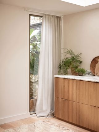 a smart curtain pole on a small window