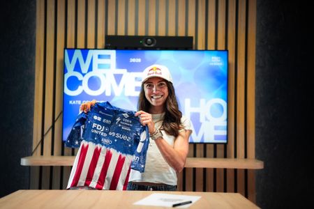 USPro road champion Kate Courtney holds her new FDJ United-SUEZ jersey after signing a short-term 2026 contract with the Women's WorldTour team