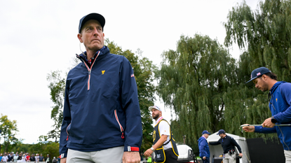 Jim Furyk looks over at the match