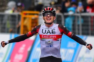 Team UAE Emirates rider US Joe Dombrowski celebrates as he crosses the finish line to win the fourth stage of the Giro dItalia 2021 cycling race 187 km between Piacenza and Sestola EmiliaRomagna on May 11 2021 Photo by Dario BELINGHERI AFP Photo by DARIO BELINGHERIAFP via Getty Images