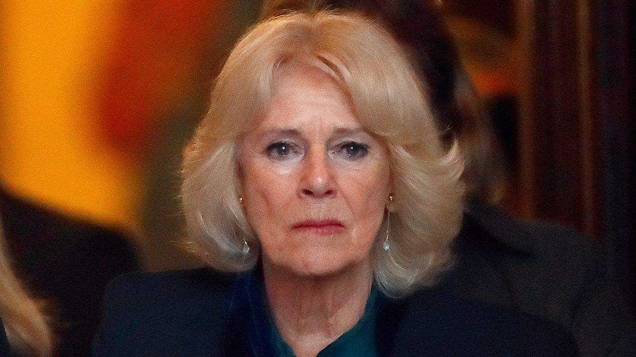 Queen Camilla looks tearful and has blonde hair