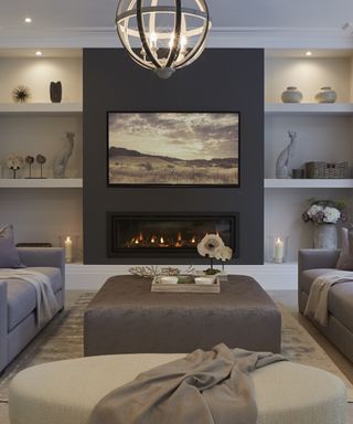 Stylish neutral living room scheme with fireplace and TV mounted onto a wall