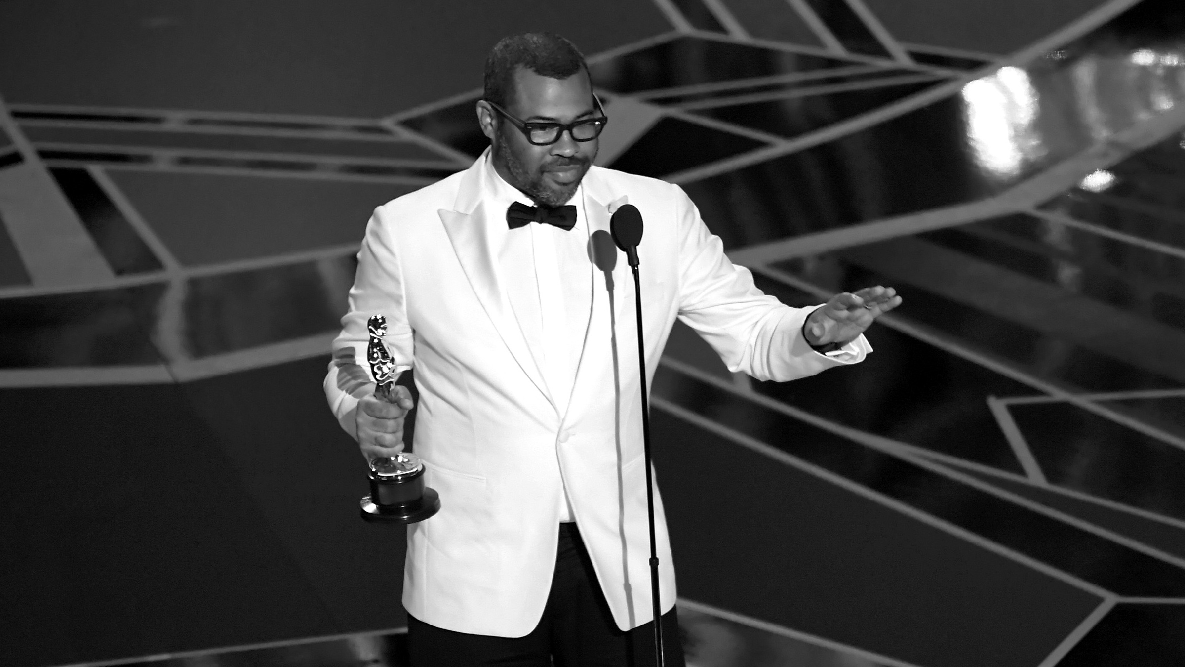 Jordan Peele accepting an award for get out