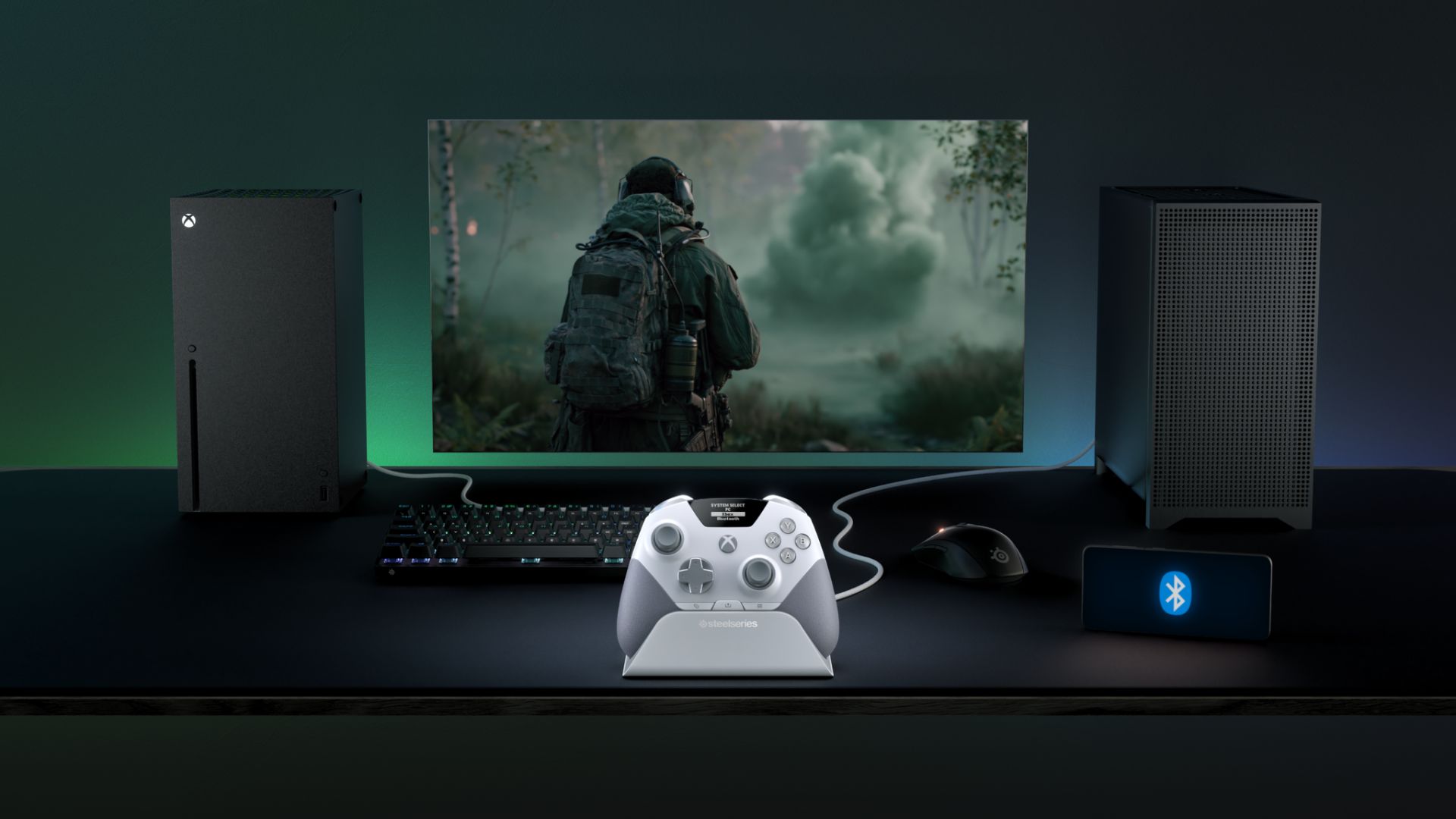 A white SteelSeries Aeon Pro on a desk setup connected to a PC and Xbox at the same time