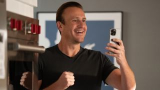 Jimmy Laird (Jason Segel) smiles at his phone on Shrinking