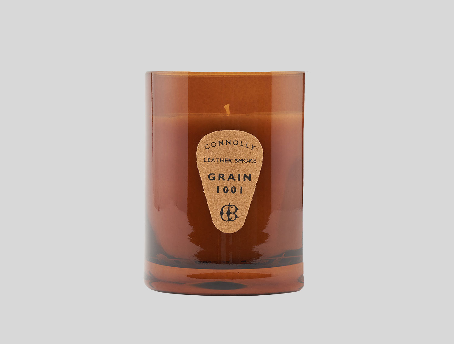 Candle in brown glass container