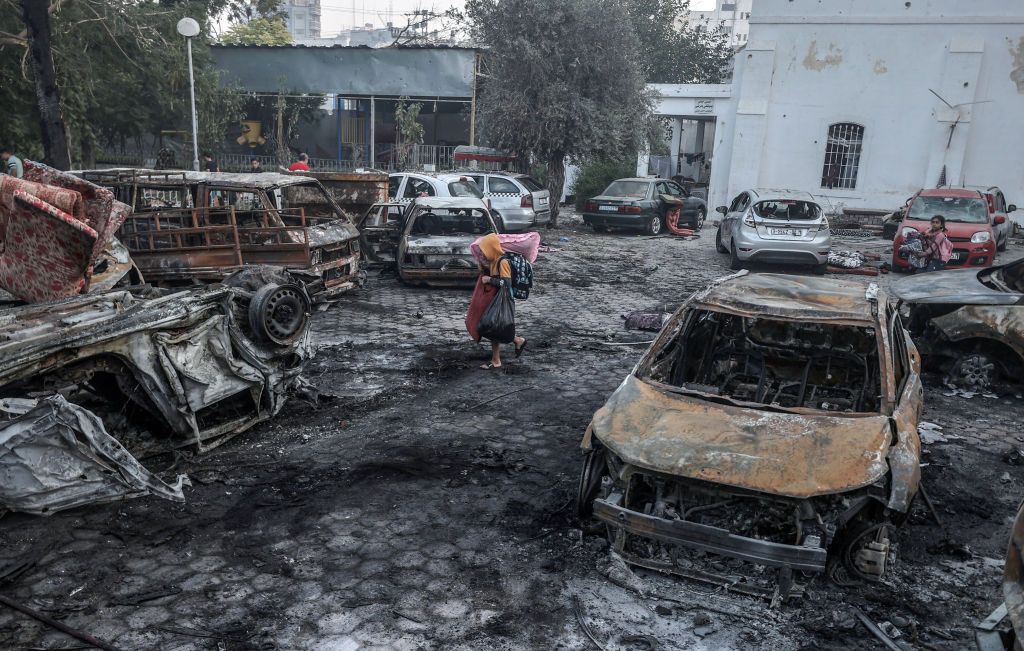 Boy tries to salvage useable items from wreckage of Gaza&#039;s Al-Ahli Baptist Hospital