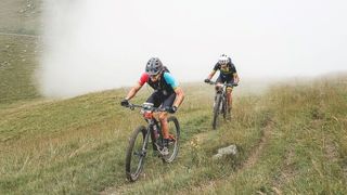 Mountain bikers climbing at Iron Bike