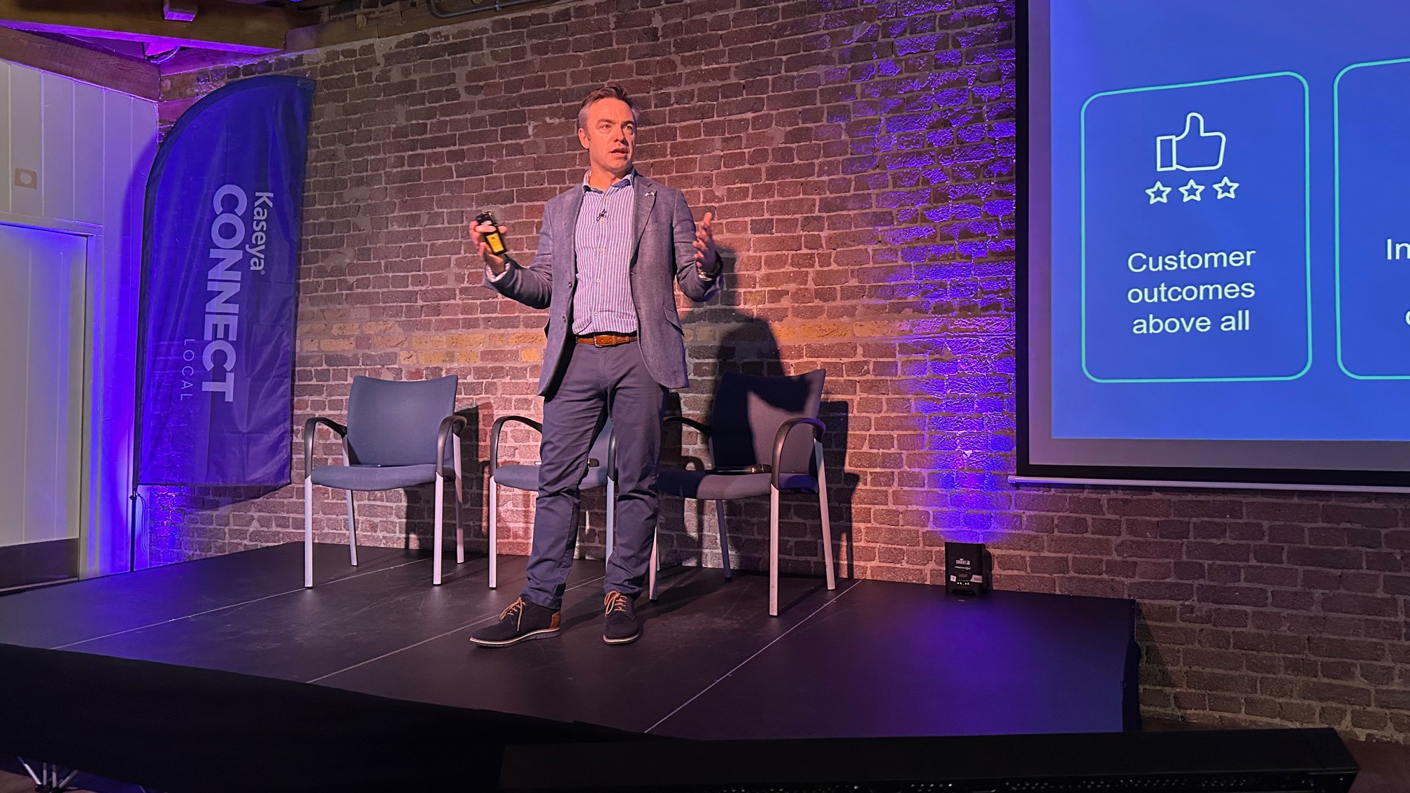 Dermot McCann, Kaseya's EVP, on stage