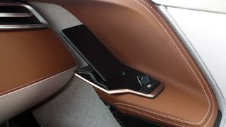 There's a wireless charging smartphone dock on the inside of each of the four doors