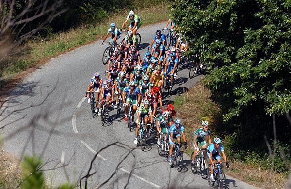 The peloton rounds a bend during stage 8