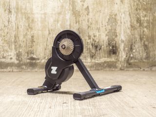 A Zwift Hub Smart turbo trainer stands in an underground car park