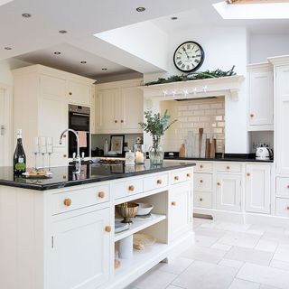 white themed kitchen with off-white cabinets