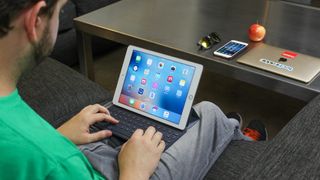 A TechRadar reviewer testing an Apple iPad