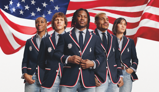 members of team USA wearing the opening ceremony uniforms for the 2024 olympics designed by ralph lauren while standing in front of the american flag
