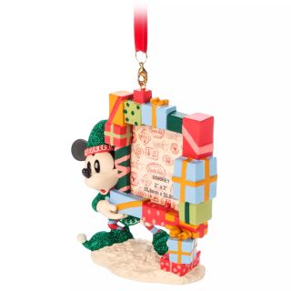 Mickey ornament holding a photo frame against a plain background