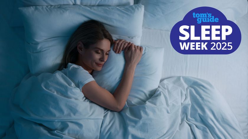 A woman with long dark hair falls asleep quickly in a comfy bed dressed with soft white linens