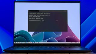Windows 10 DISM settings displayed on a laptop