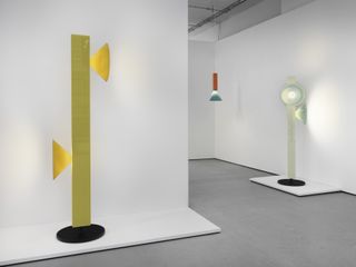 Yellow and white floor lamps and red hanging lamp