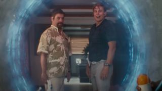 Zach Galifianakis and Billy Magnussen stand by a portal as Jumbaa and Pleakley in human form in the live-action Lilo & Stitch remake.