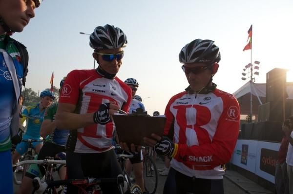 The riders sign on before the start
