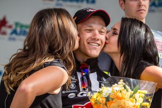 Nikias Arndt (Giant-Alpecin) gets the kisses for his win