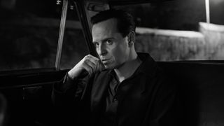 A monochromatic image of Andrew Scott's Thomas Ripley looking stoic in Netflix's Ripley TV show