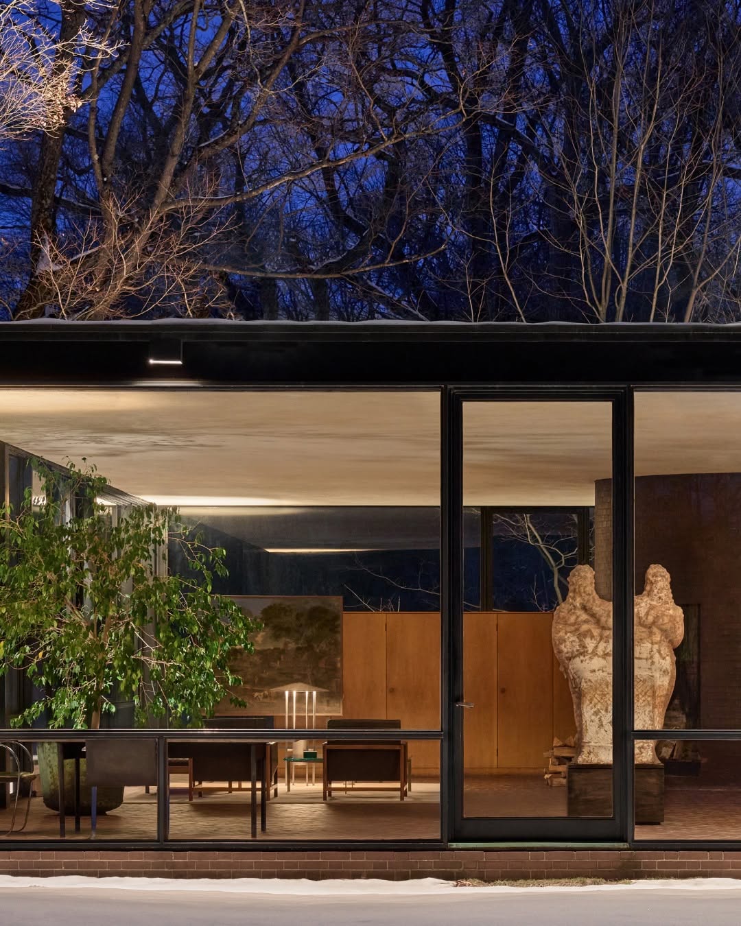Metal lamp with cone shade and structural bottom half shown in Glass House, Connecticut