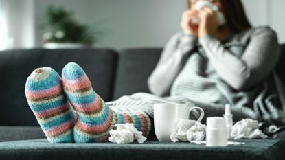 A woman sick on the couch
