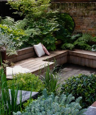 small courtyard garden design with wooden benches
