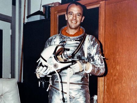 Astronaut Alan Shepard, the first American in space, poses here in his Mercury flight suit. 
