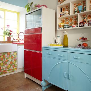kitchen with vibrant colour and red cabinet