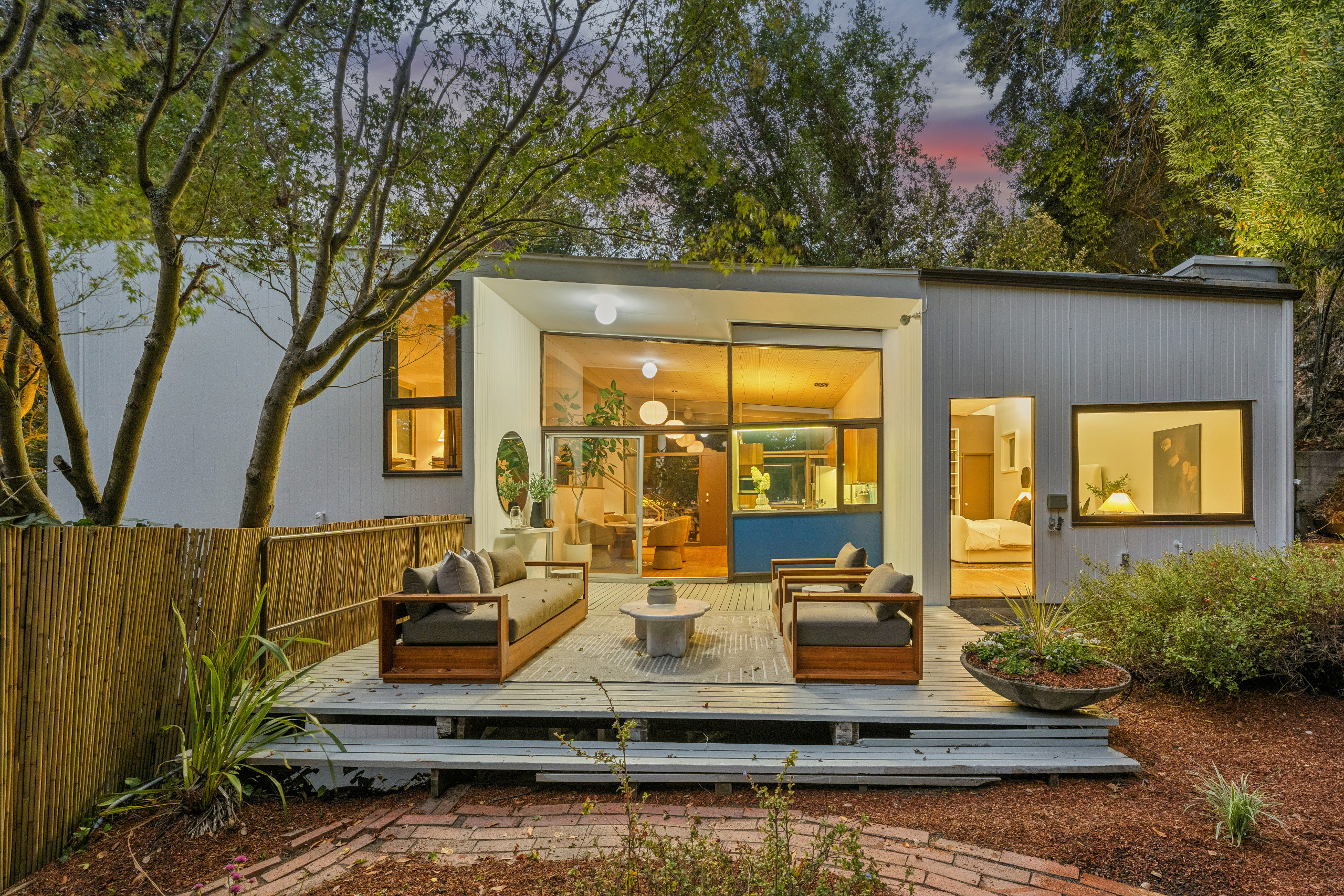 The upper floor has direct access to the deck and the yard