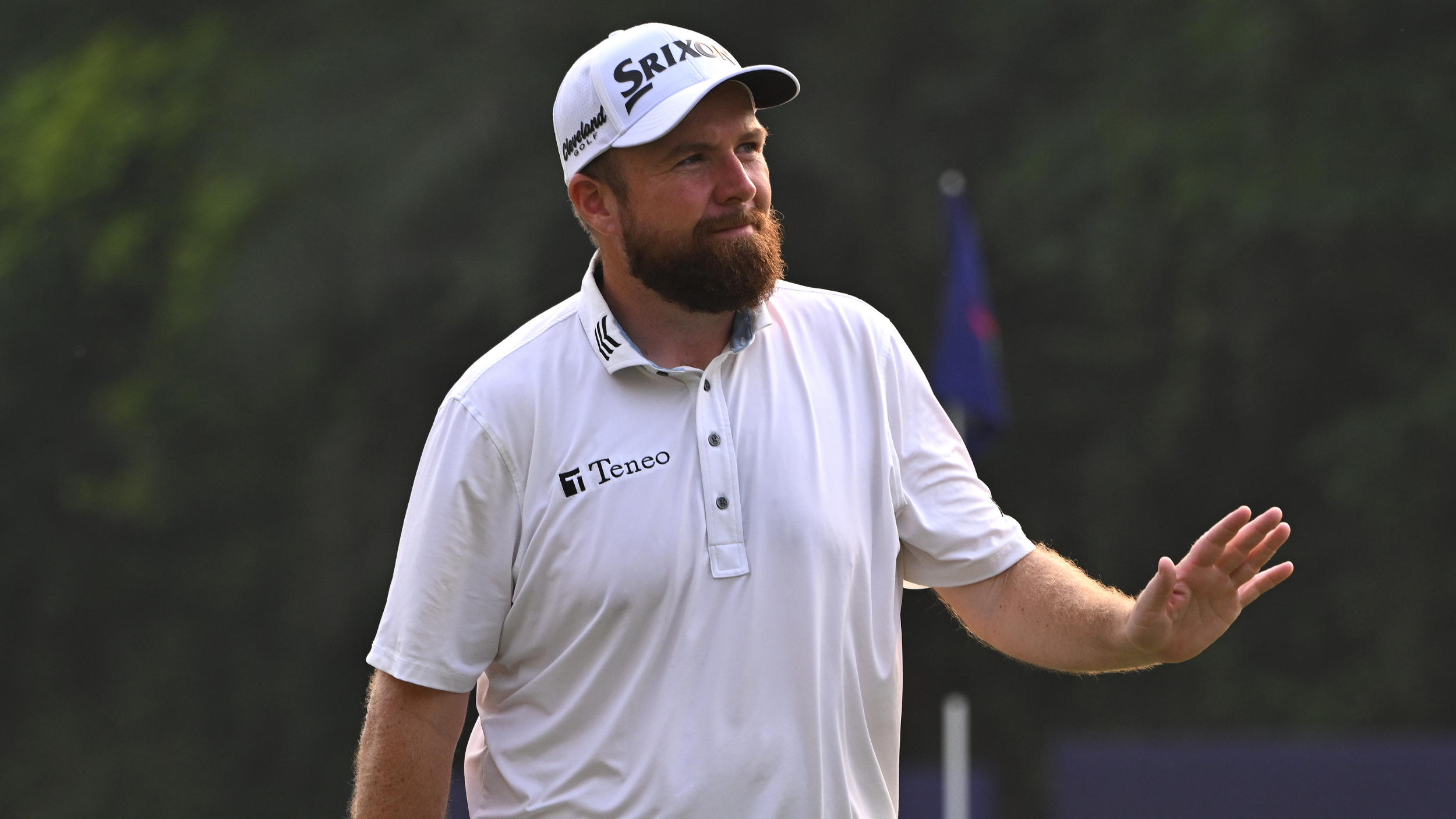 Shane Lowry waves to fans