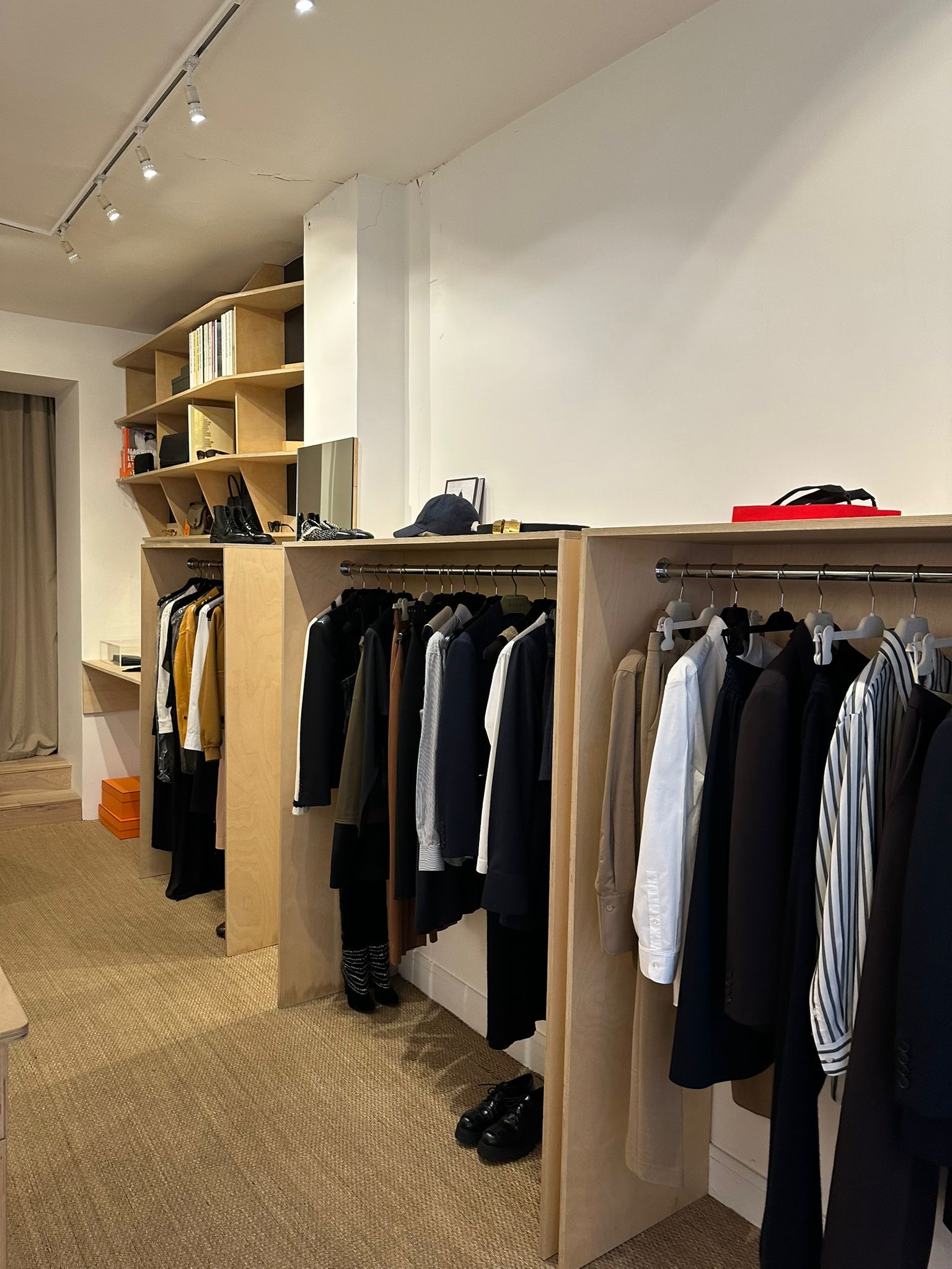 Clothing displayed inside Odetta Vintage, one of the best vintage stores in Paris.