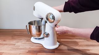 Demonstrating tilt-head design on Cuisinart Precision stand mixer