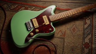 A Jet JJ-300 P90 offset guitar on a rug