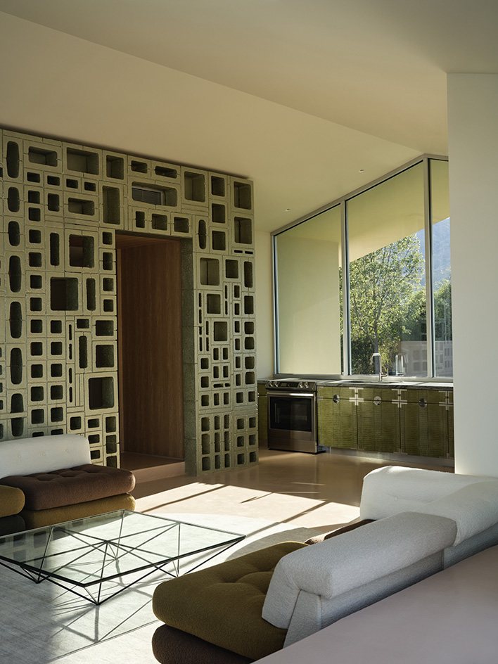 Desert house by Robert Stone, a home made with perforated partitions and an intense pitched low roof