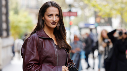 a beautiful brunette woman wearing burgundy leather jacket with matching burgundy lipstick - best burgundy lipstick