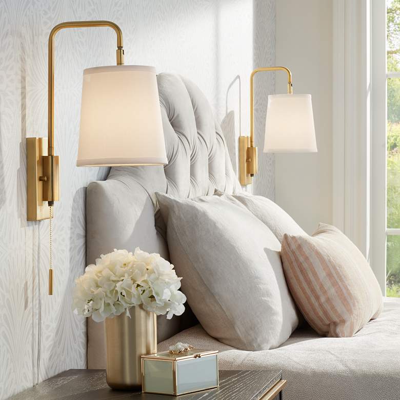 sconces near a bed