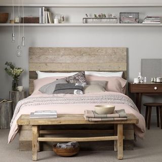 coastal bedroom with driftwood side table and lazy linen duvet cover in pink