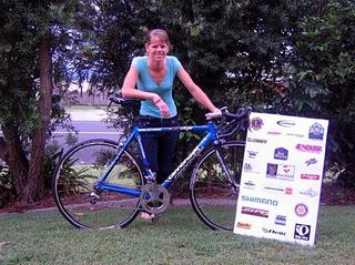 Lorian Graham at the launch of the Amy Gillett Foundation Charity Ride, standing behind the major prize draw for the progressive raffle, a Cannondale Six13 bike kitted with Shimano Dura-Ace components.