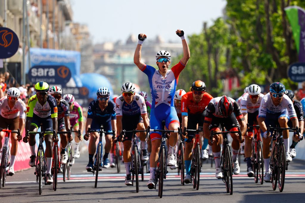 Team GroupamaFDJs French rider Arnaud Demare celebrates as he crosses the finish line to win the 4th stage of the Giro dItalia 2022 cycling race 174 kilometers between Catania and Messina Sicily on May 11 2022 Photo by Luca Bettini AFP Photo by LUCA BETTINIAFP via Getty Images