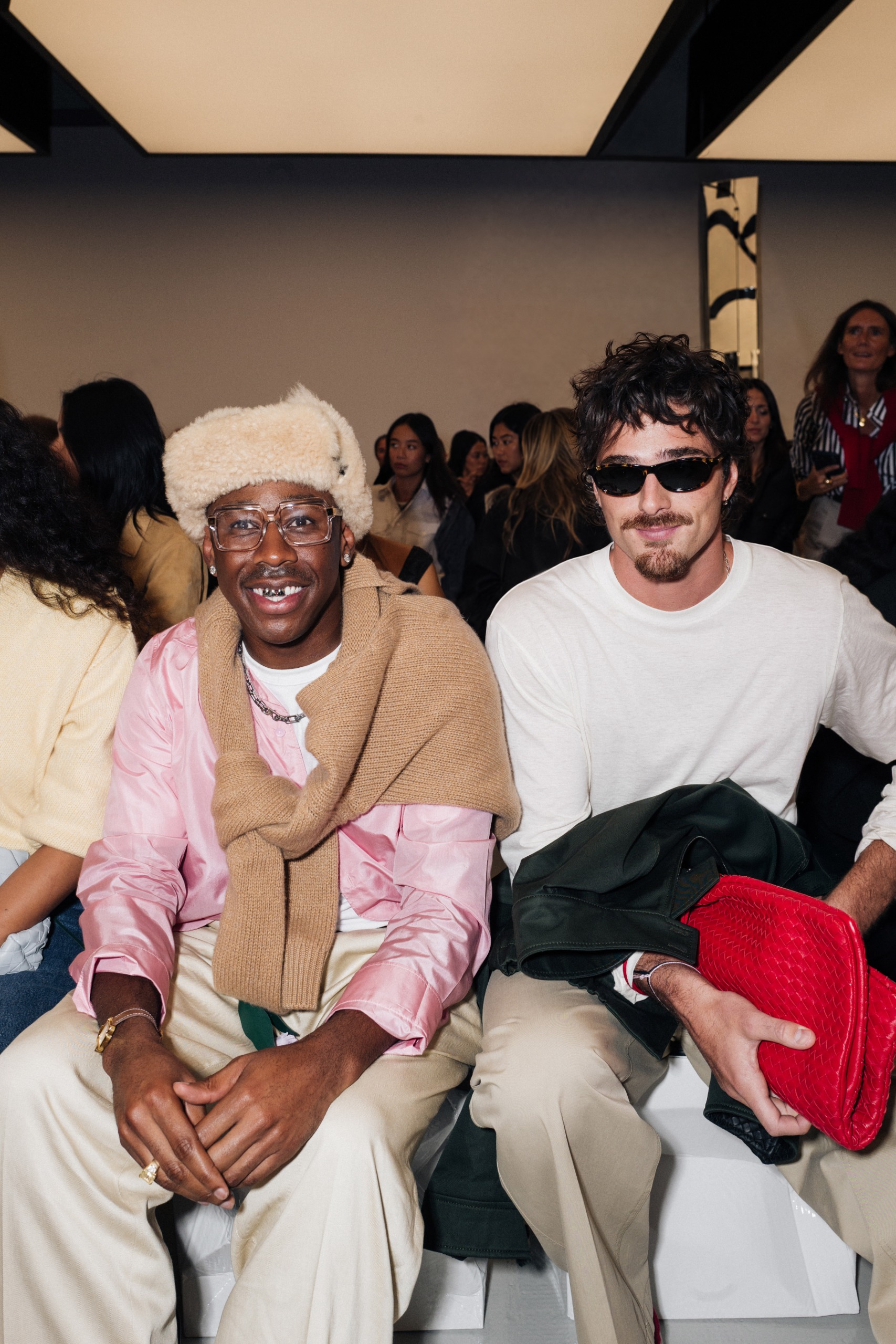 Jacob Elordi sitting in the front row at the Bottega Veneta show next to Tyler the Creator.
