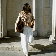 Influencer wearing wide-leg jeans, a lace cami and a blazer