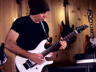 Want to know how to play Joe Satriani's Flying In A Blue Dream? You might get some pointers here
