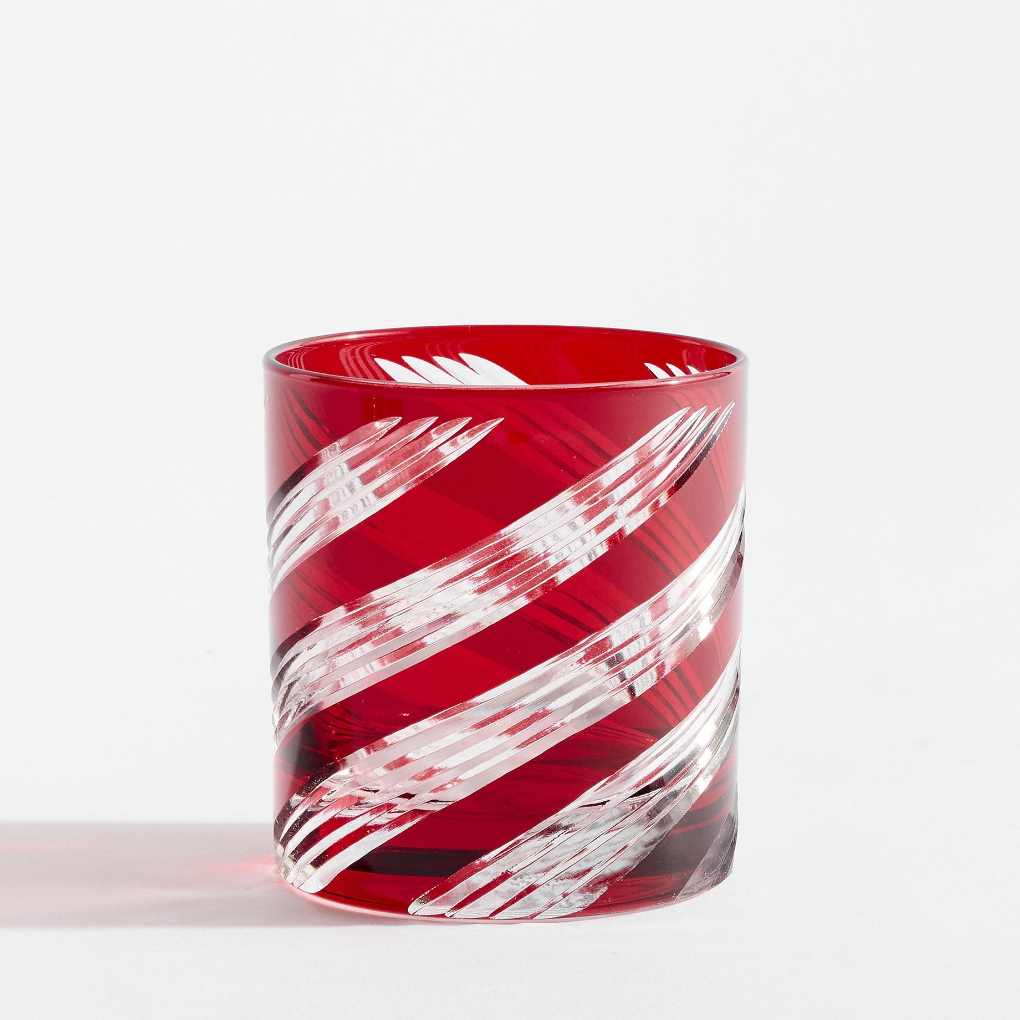 Red glass tumbler with white swirls